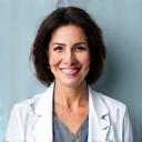 Portrait of Dr. Ana Acosta, a cheerful woman with a compassionate smile, wearing a professional lab coat.